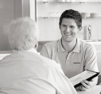 Two clinic employees reviewing records